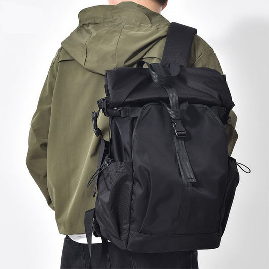 Rolltop backpack – ideal for travel and work, featuring multiple compartments, water-resistant fabric, and a dedicated laptop sleeve